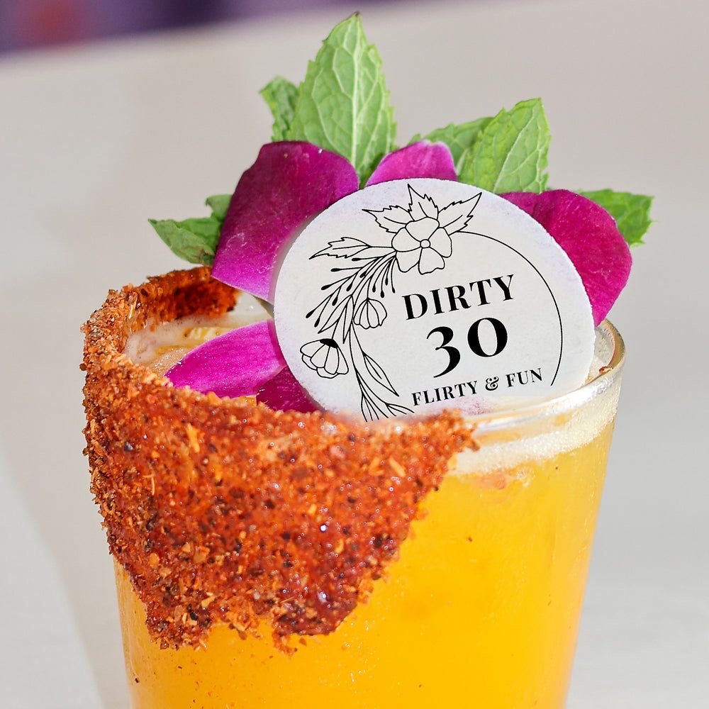 Dirty 30 birthday cocktail with custom topper and spiced rim