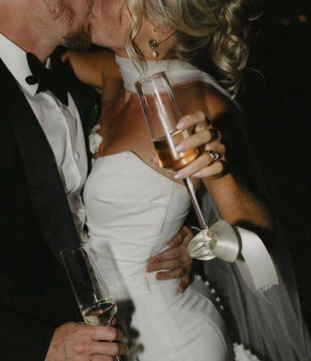 Bride and groom toasting at their wedding reception