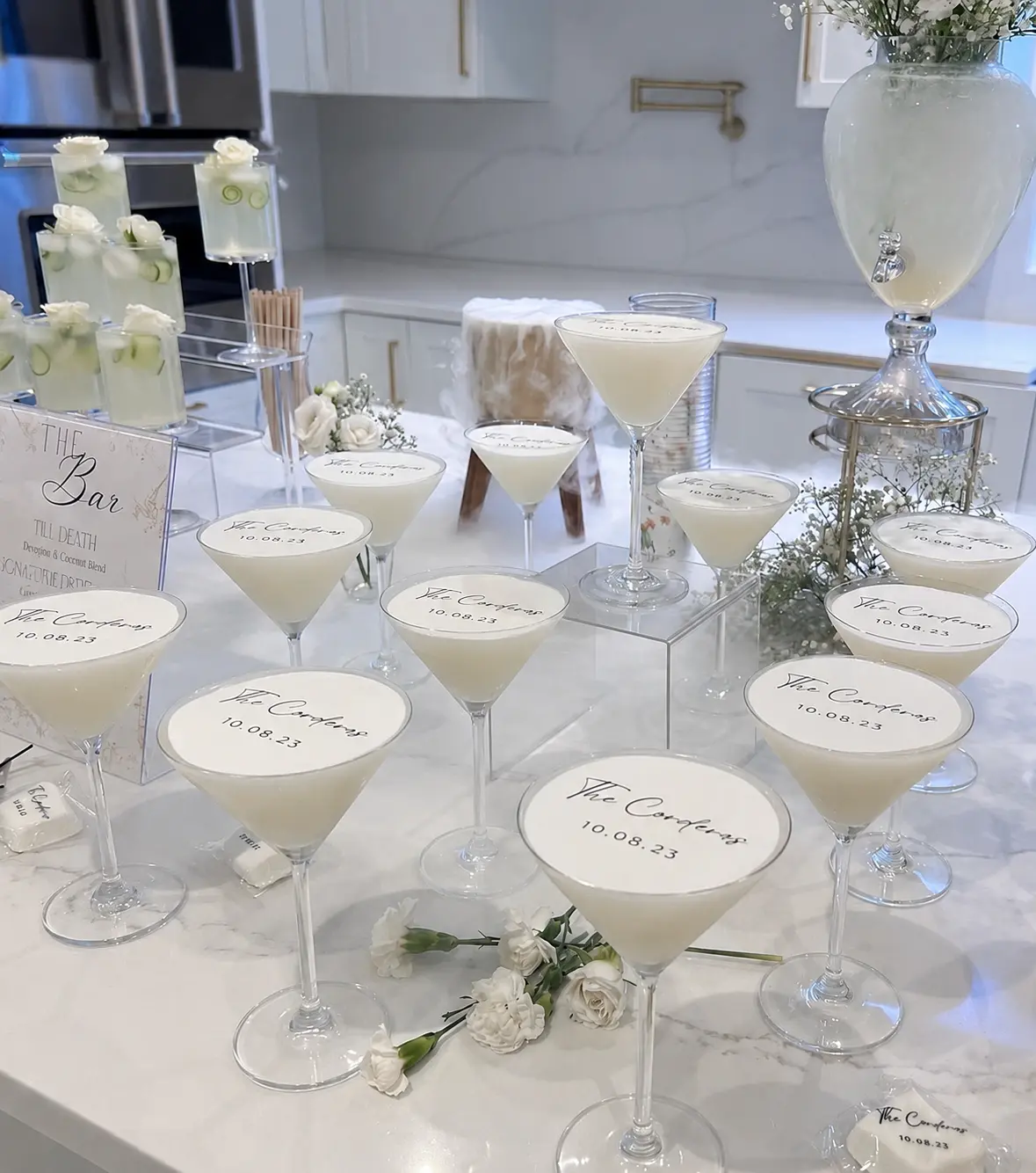 Row of garnished signature martinis on a bar