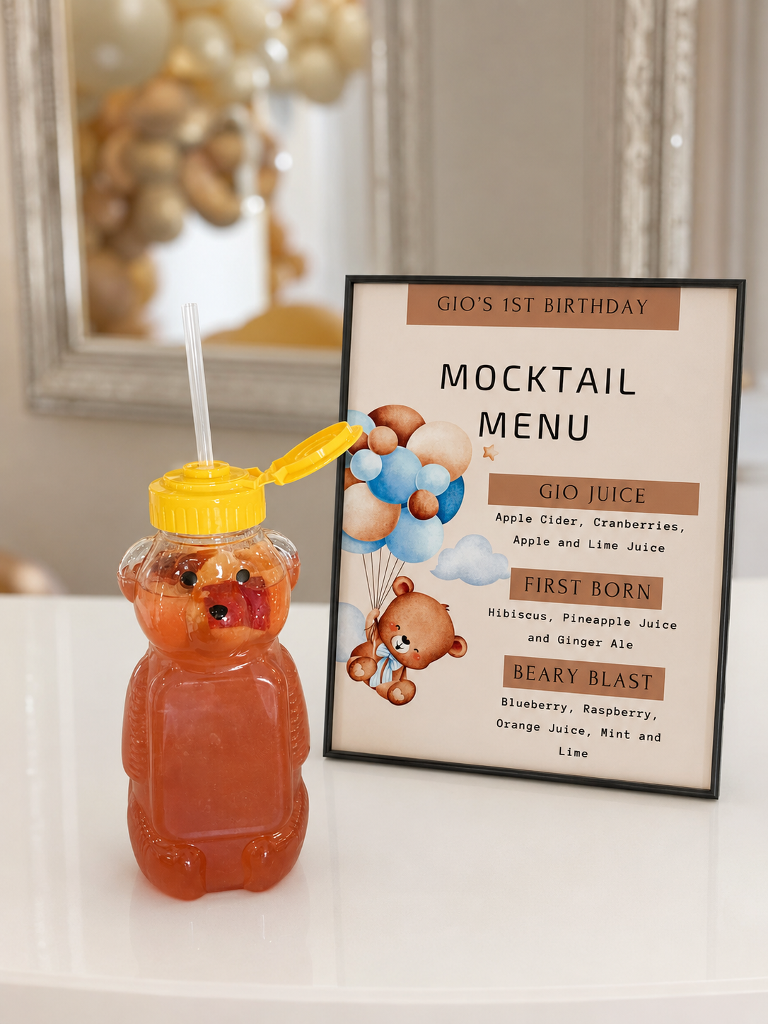 Gio's 1st birthday mocktail menu with bear-shaped drink bottle